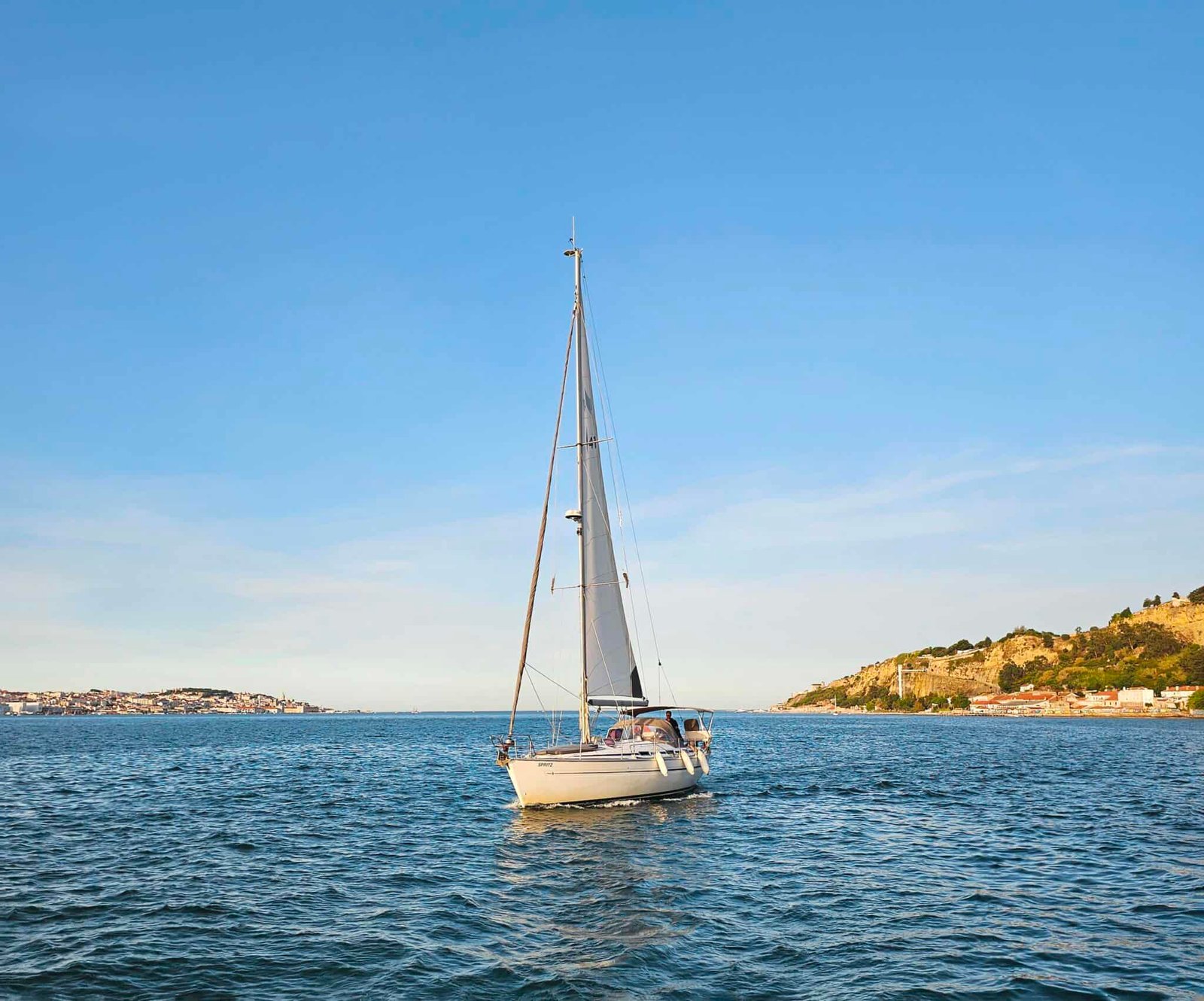 Sailboat "Spritz" sailing towards the sun