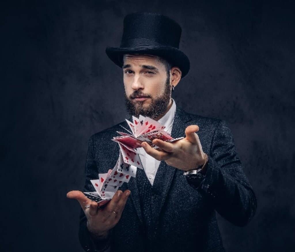A magician with his cards, ready to perform a magic trick and entertain the audience